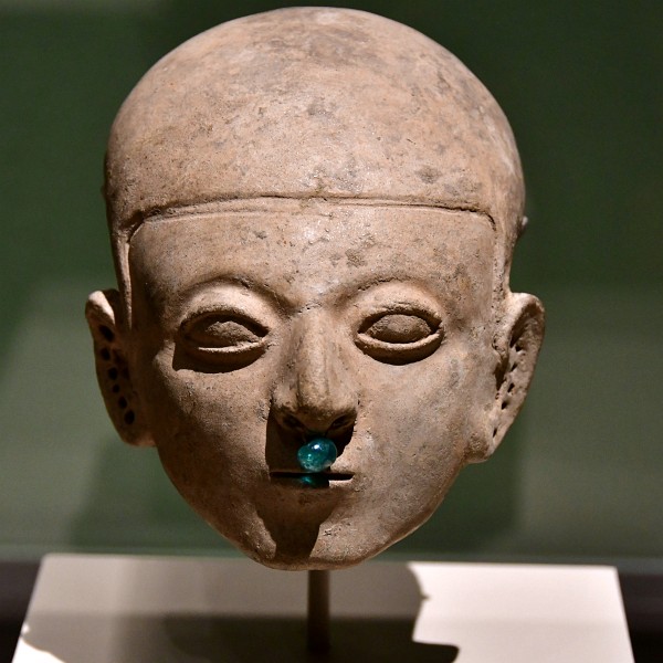 Earthenware Head With An Emerald in its Nose From the Tumaco La-Tolita Culture of Ecuador. Dated 300 BCE - 500 CE