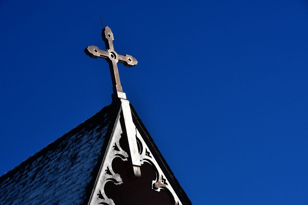 Sun-Drenched Cross and Blue Sky